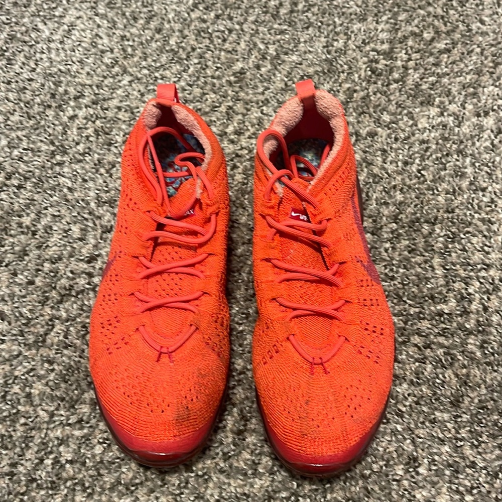 Red Nike vapor max 2023 sneakers.